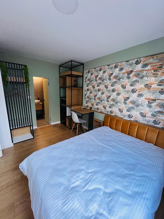 Postel nebo postele na pokoji v ubytování Moxa Residence