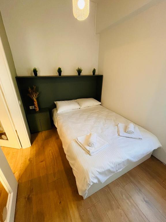 Postel nebo postele na pokoji v ubytování Moxa Residence