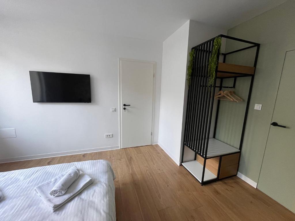 Postel nebo postele na pokoji v ubytování Moxa Residence