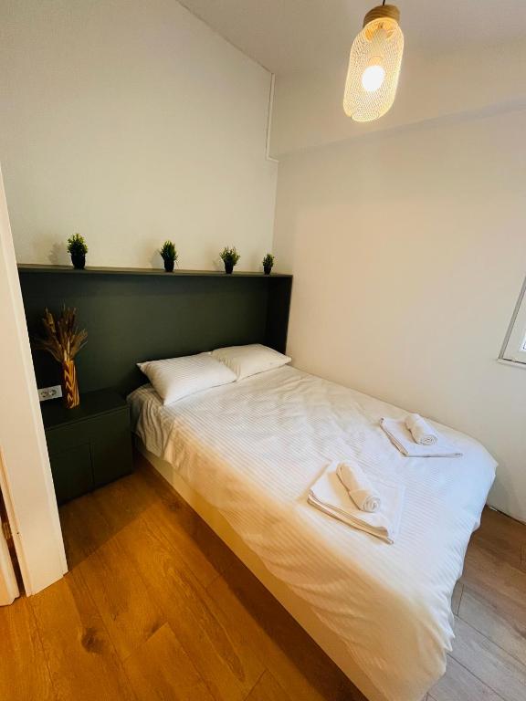 Postel nebo postele na pokoji v ubytování Moxa Residence