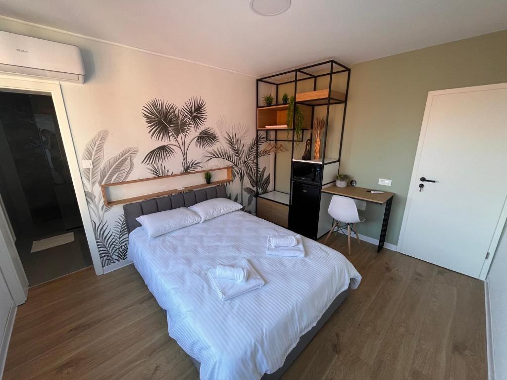 Postel nebo postele na pokoji v ubytování Moxa Residence