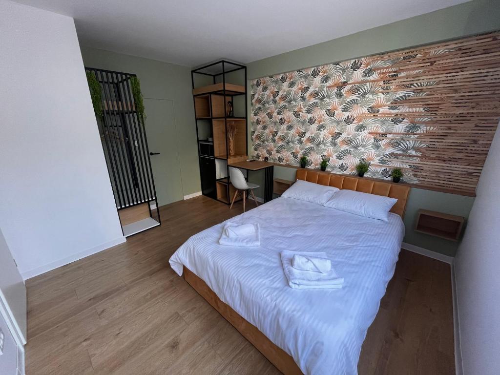 Postel nebo postele na pokoji v ubytování Moxa Residence