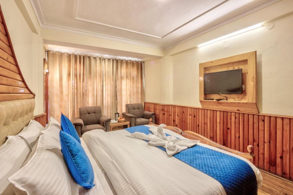 Postel nebo postele na pokoji v ubytování Hotel Ibex