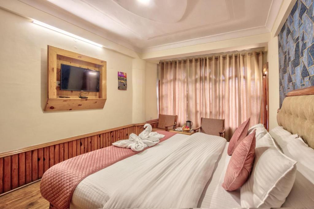 Postel nebo postele na pokoji v ubytování Hotel Ibex