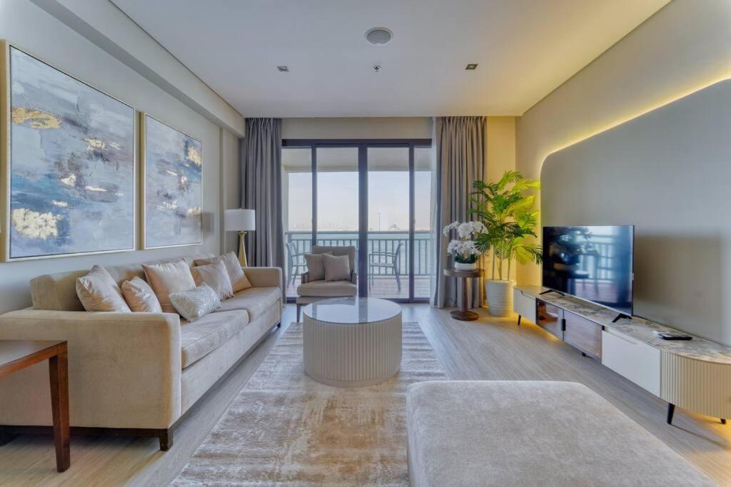 Area soggiorno di FIRST CLASS 1BR Anantara The Palm Hotel