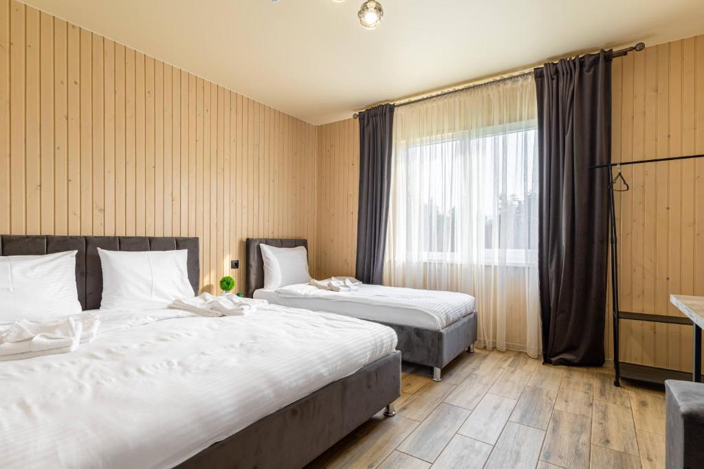 Postel nebo postele na pokoji v ubytování Fenix