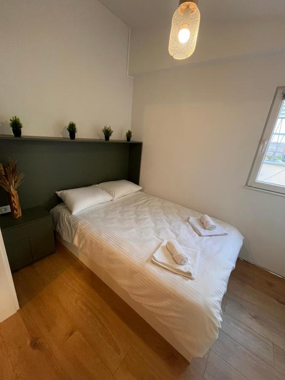 Postel nebo postele na pokoji v ubytování Moxa Residence