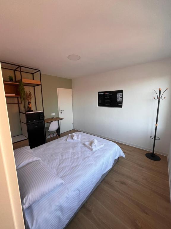 Postel nebo postele na pokoji v ubytování Moxa Residence