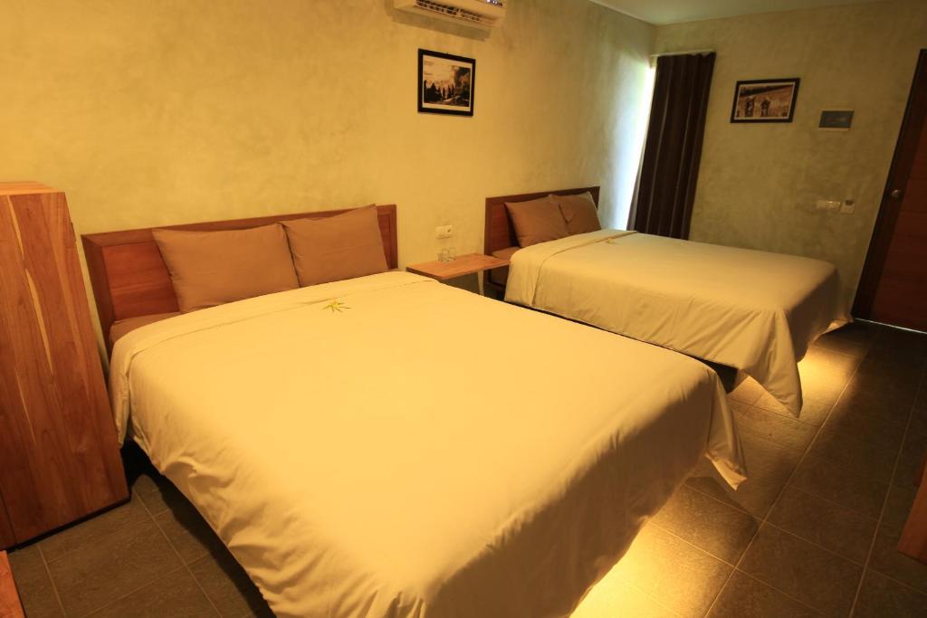 Ein Bett oder Betten in einem Zimmer der Unterkunft Bale Karang Cottages