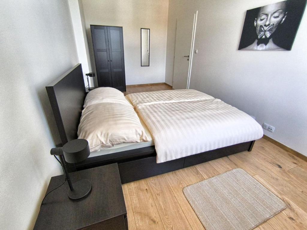 Postel nebo postele na pokoji v ubytování Isabel's Suites