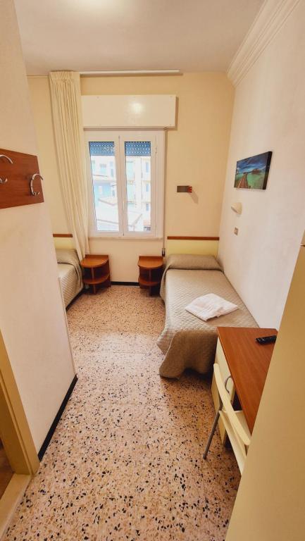 Postel nebo postele na pokoji v ubytování Hotel Arno