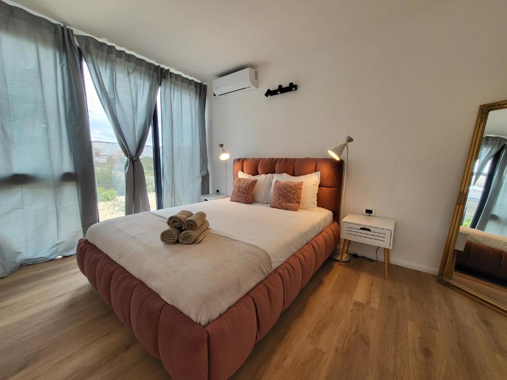 Postel nebo postele na pokoji v ubytování Casa en Sol -Therme Balotesti