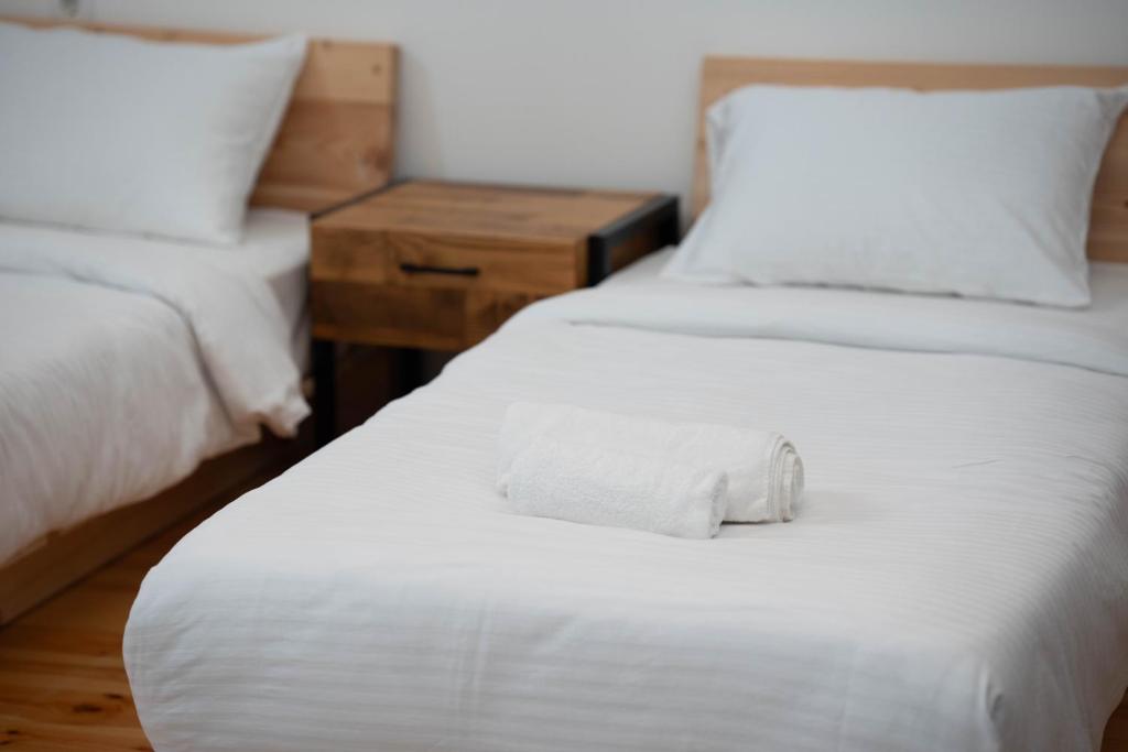 Postel nebo postele na pokoji v ubytování Vagabond - Cozy Guesthouse in Lagodekhi