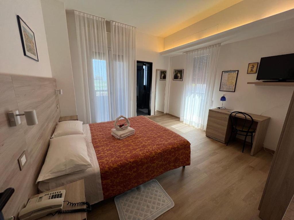Postel nebo postele na pokoji v ubytování Hotel San Marco