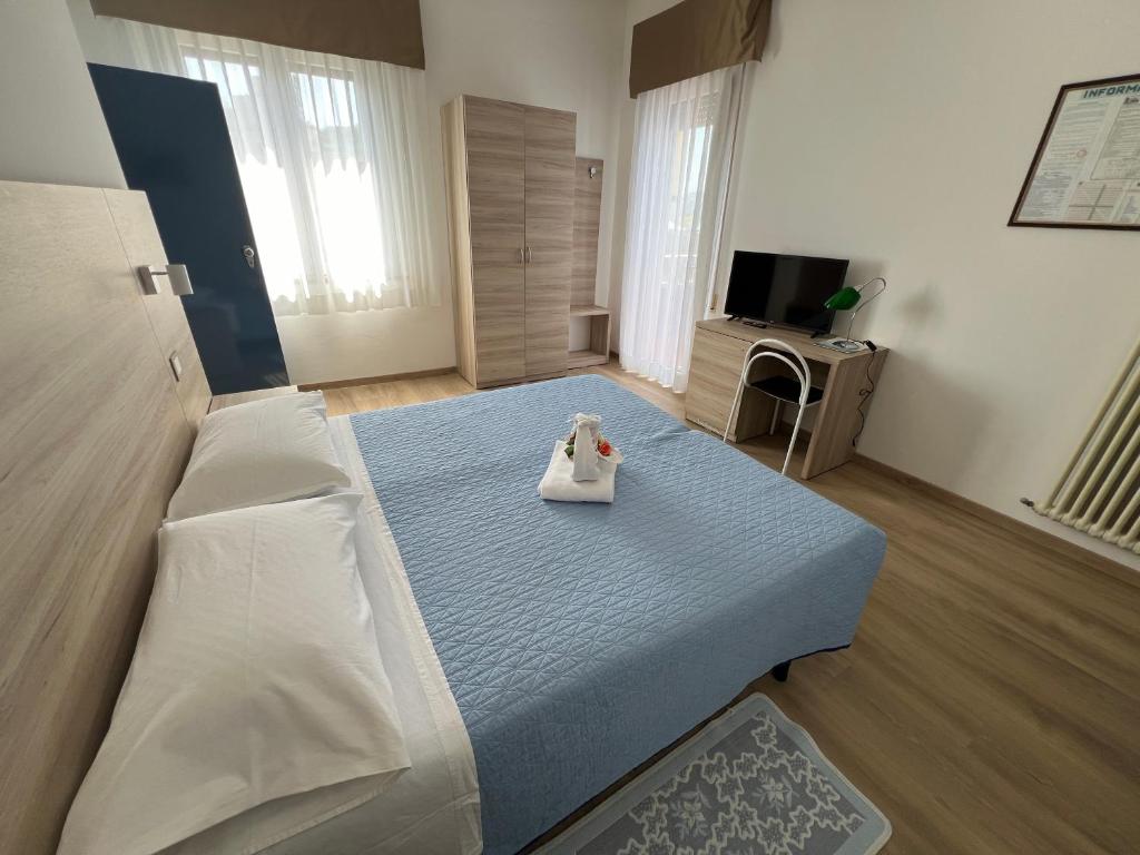 Postel nebo postele na pokoji v ubytování Hotel San Marco