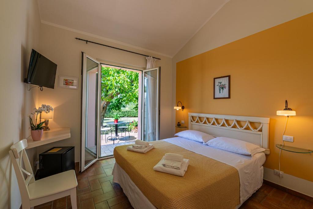 Postel nebo postele na pokoji v ubytování La Visciola - Country House del Conero