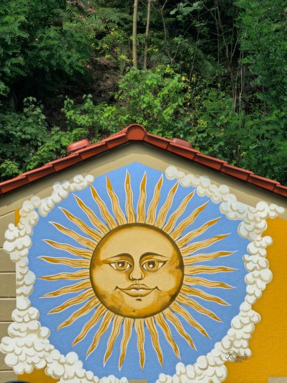 a painting of a sun with a face on it at Villa Sonnenblick in Kurort Rathen