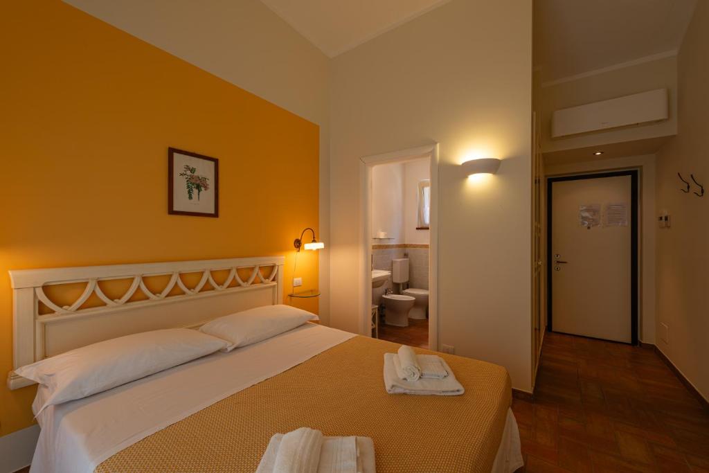 Postel nebo postele na pokoji v ubytování La Visciola - Country House del Conero