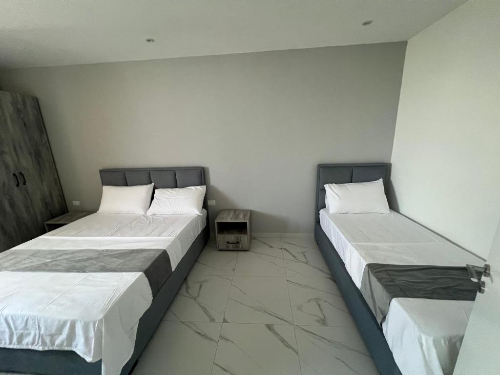 Postel nebo postele na pokoji v ubytování Suli Beach Apartments