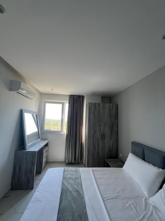 Postel nebo postele na pokoji v ubytování Suli Beach Apartments