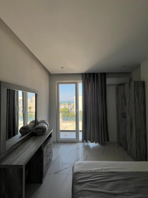 Postel nebo postele na pokoji v ubytování Suli Beach Apartments