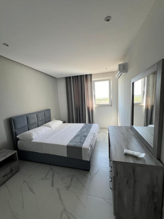 Postel nebo postele na pokoji v ubytování Suli Beach Apartments