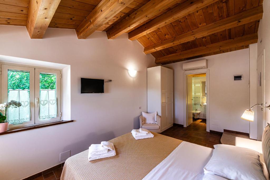 Postel nebo postele na pokoji v ubytování La Visciola - Country House del Conero