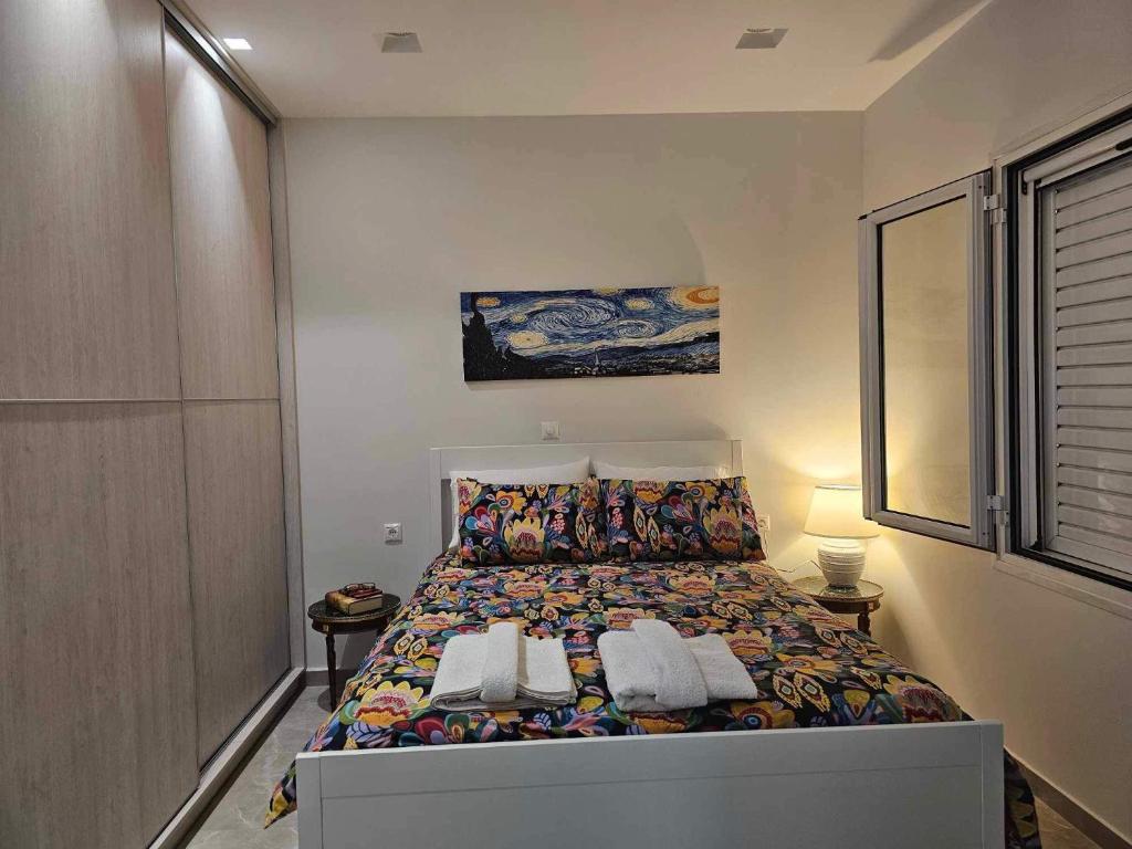 a bedroom with a bed with two pillows at Guarantee to make you say wow! in Athens
