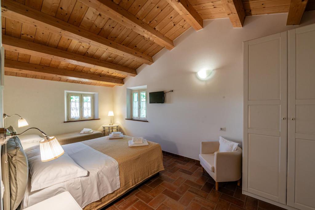 Postel nebo postele na pokoji v ubytování La Visciola - Country House del Conero