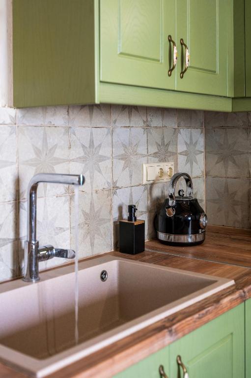 Kuchyň nebo kuchyňský kout v ubytování Papadia Luxury Apartments