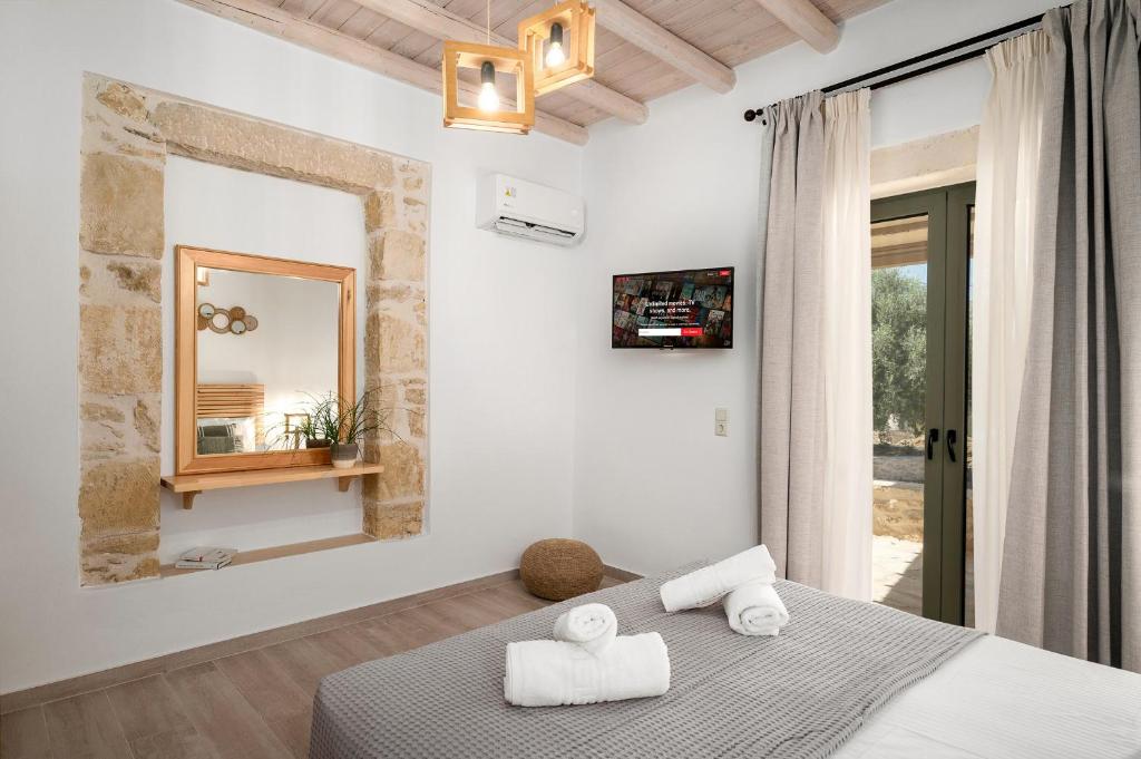 Postel nebo postele na pokoji v ubytování Papadia Luxury Apartments