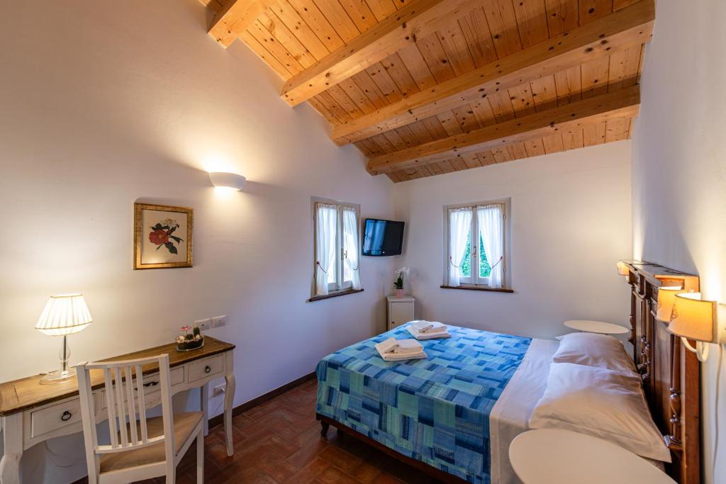 Postel nebo postele na pokoji v ubytování La Visciola - Country House del Conero