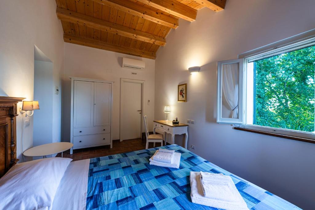Postel nebo postele na pokoji v ubytování La Visciola - Country House del Conero