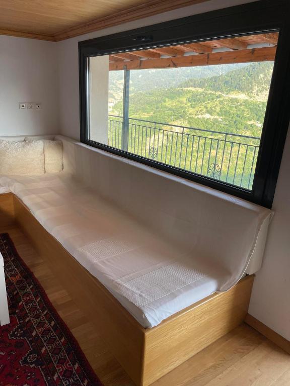 Postel nebo postele na pokoji v ubytování Kostis Central Loft