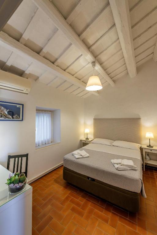 Postel nebo postele na pokoji v ubytování La Visciola - Country House del Conero