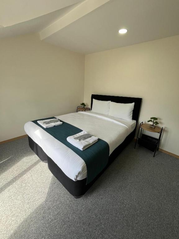 New Garden Airport Hotel - Luxe Viervoudige Kamer