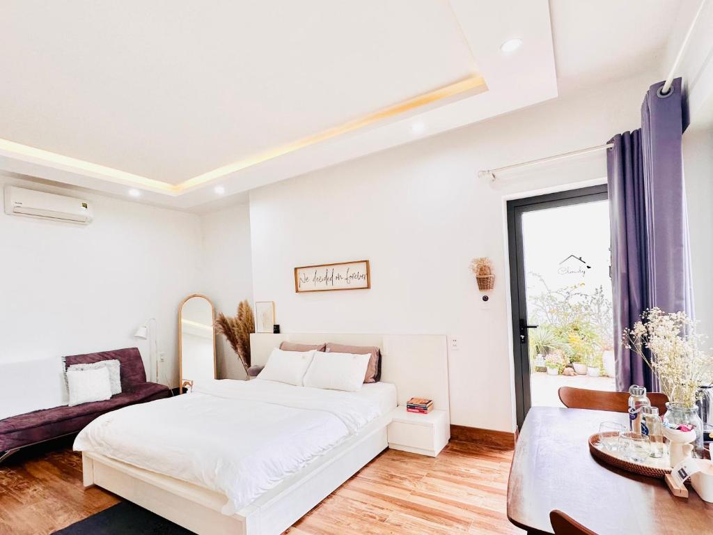 Postel nebo postele na pokoji v ubytování Cloudy Homestay Hoi An