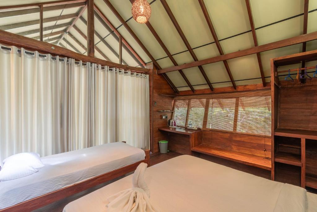 Postel nebo postele na pokoji v ubytování Kaala Kalaththewa Luxury Eco Resort