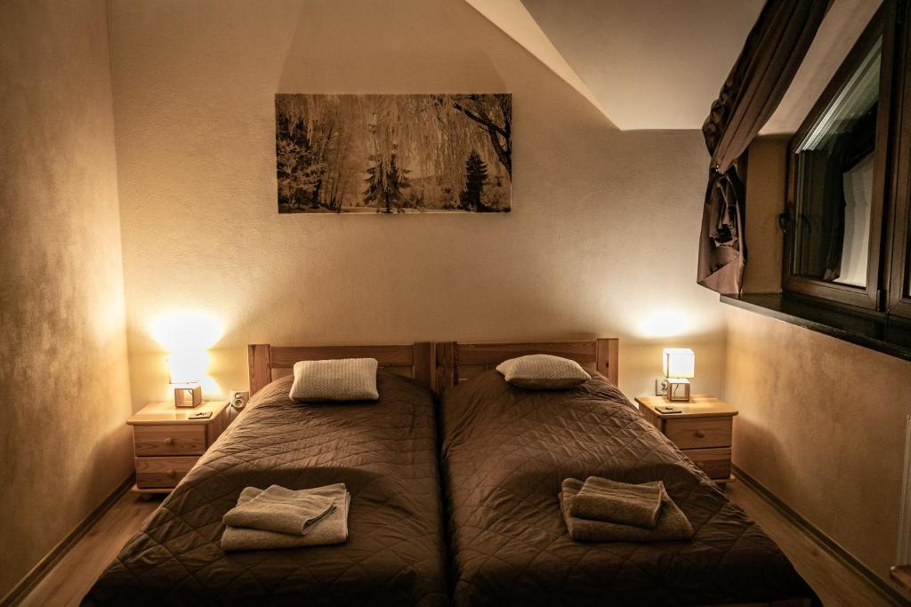 Postel nebo postele na pokoji v ubytování Pokoje Siódme Niebo