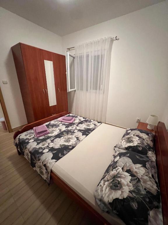 Postel nebo postele na pokoji v ubytování MarBis Apartmani near the sea