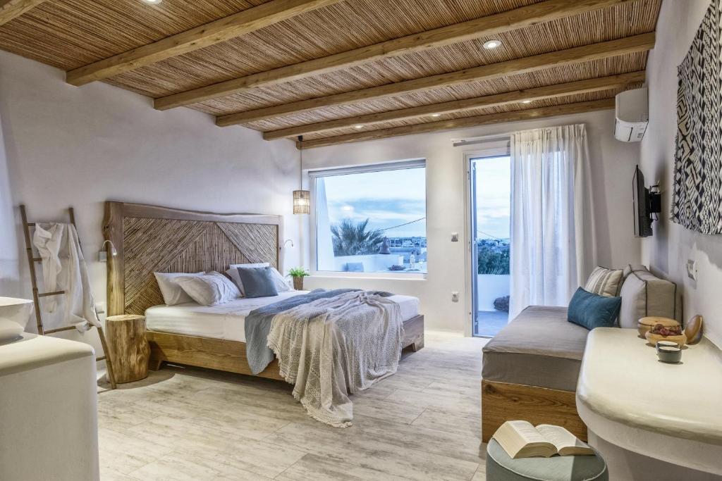 Postel nebo postele na pokoji v ubytování Orkos Beach Hotel