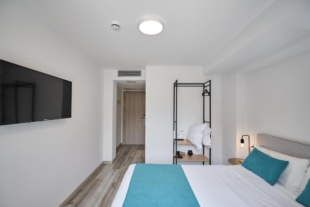 Postel nebo postele na pokoji v ubytování Hotel Pombal Rooms