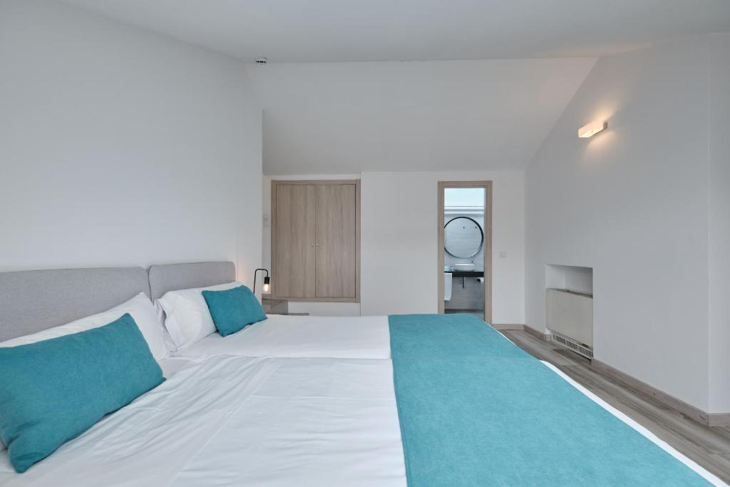 Postel nebo postele na pokoji v ubytování Hotel Pombal Rooms