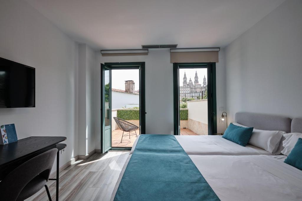 Postel nebo postele na pokoji v ubytování Hotel Pombal Rooms