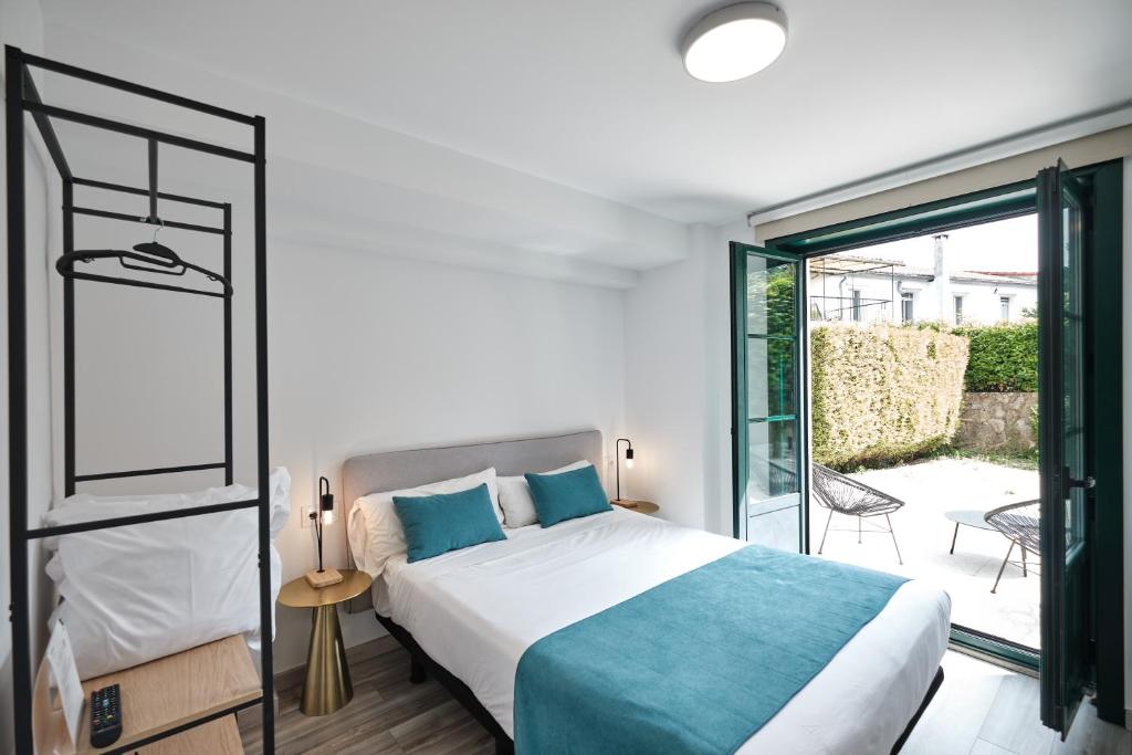 Postel nebo postele na pokoji v ubytování Hotel Pombal Rooms