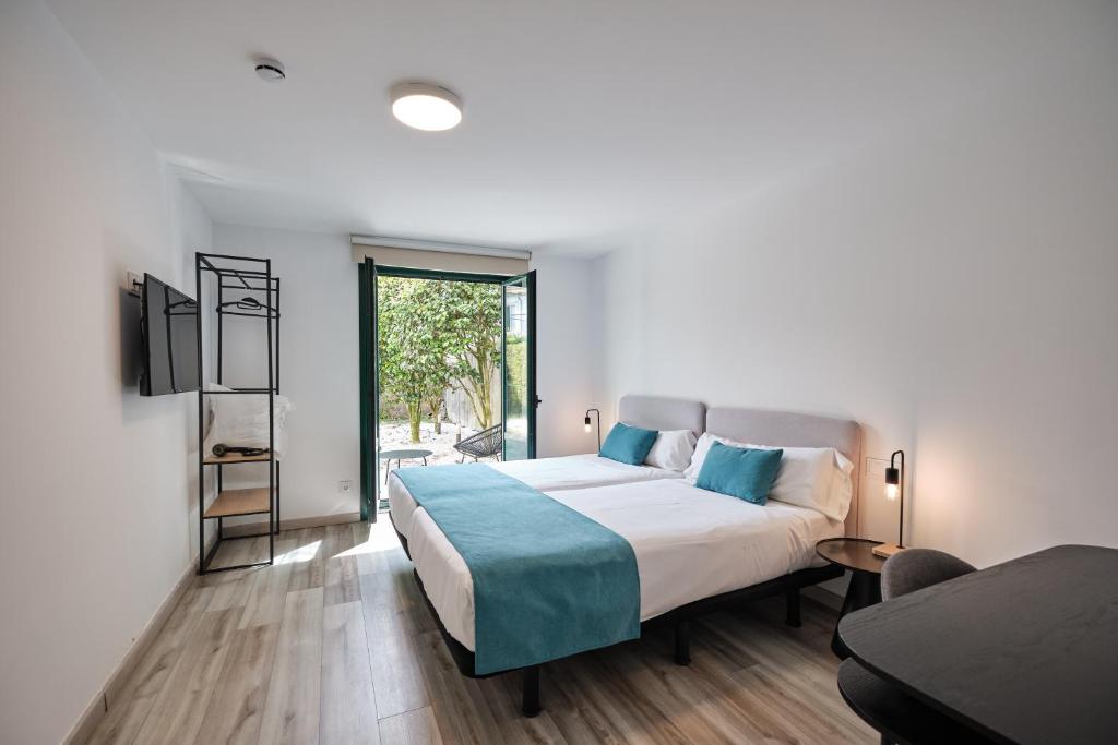 Postel nebo postele na pokoji v ubytování Hotel Pombal Rooms