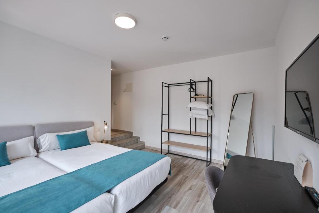 Postel nebo postele na pokoji v ubytování Hotel Pombal Rooms