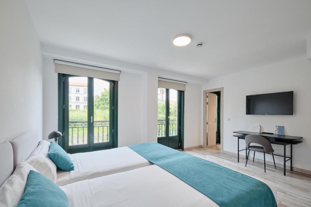 Postel nebo postele na pokoji v ubytování Hotel Pombal Rooms