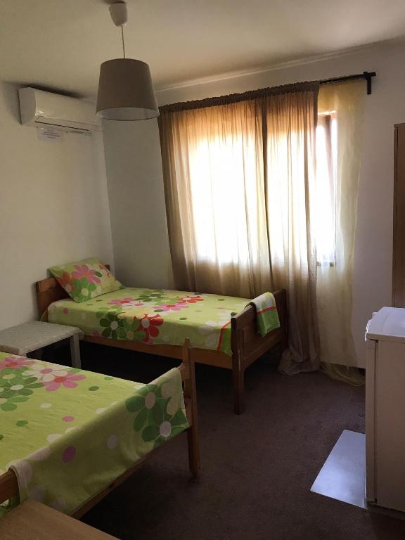Postel nebo postele na pokoji v ubytování Vila ALBA AREAL