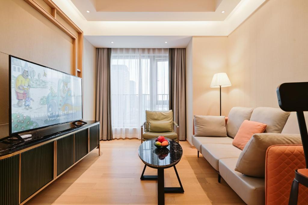 TV a/nebo společenská místnost v ubytování Raffles Executive Apartment - Guangzhou Huijin International Finance Center, Keyun Road Metro Station Branch-Canton Fair Free Shuttle